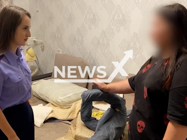 Photo shows a 24-year-old woman from Volgograd, Russia, being questioned by police, undated. She is arrested for being suspected of killing her son. Note: Picture is screenshot from a video. (Investigative Committee of Russia/Newsflah)