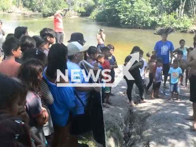 Picture shows indigenous people on the Laje-Komi-Memen River, in Guajara-Mirim, Brazil, undated. The Laje-Komi-Memen River was  recognized as a living entity and subject of rights by the City Council. Note: Picture is a screenshot from video. (Newsflash)