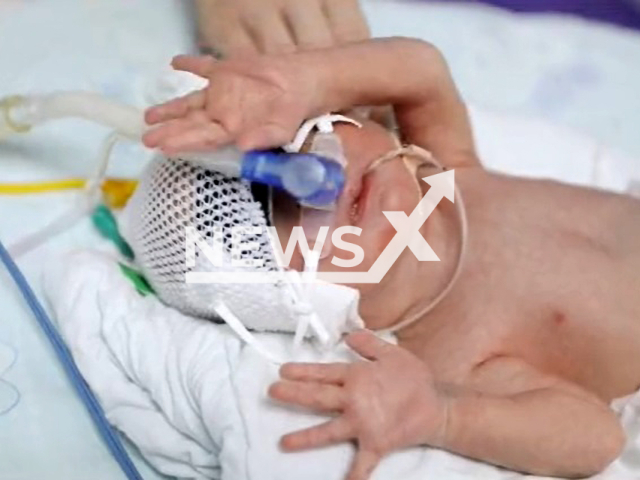 Woman gives birth to a son after having 13 miscarriages in Wuhan, China. Note: Image is a screenshot from video. (AsiaWire)