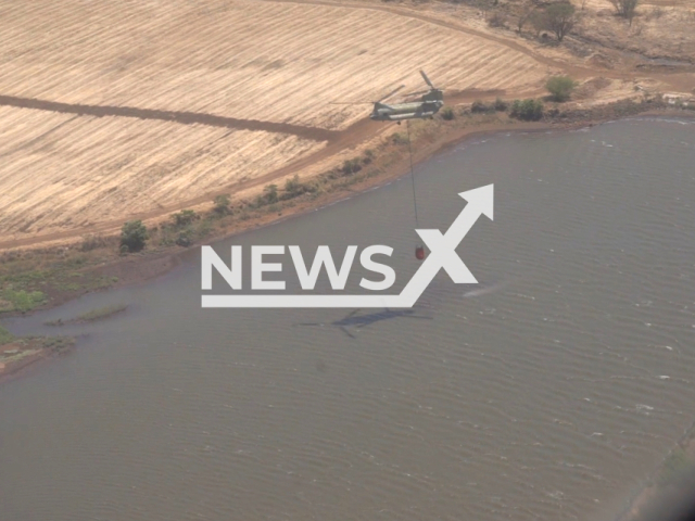 Hawaii army national guard CH47 Chinooks battle wildfires with aerial water drops on Maui on the 9th of August 2023. Note: This picture is a screenshot from the video. (DVIDS/Clipzilla)