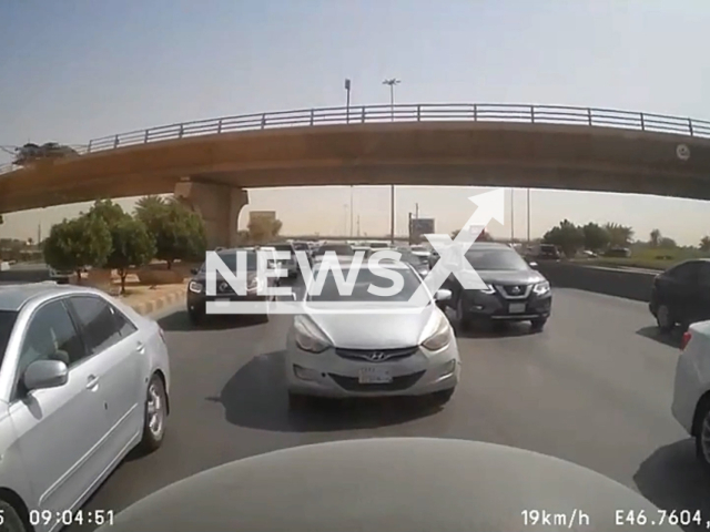 A vehicle fell from the top of a bridge after breaching the iron barrier in Riyadh, Saudi Arabia. Note: This picture is a screenshot from the video (Newsflash).