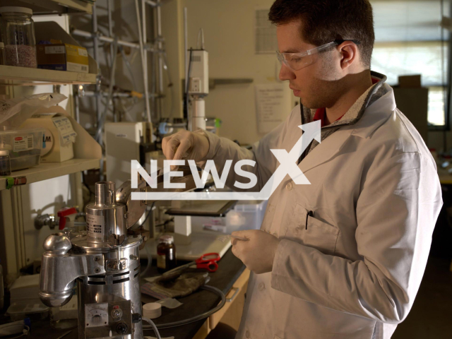 Graduate student Paul Savas feeds raw plastic into a crusher to prepare it for pyrolysis, or heating in an inert atmosphere.
Note: News release photo(Jeff Fitlow/Newsflash).