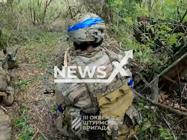 Ukrainian soldiers engaged in a fierce battle pushing forward in the forest near Bakhmut in Ukraine in undated footage. The footage was released by the 3rd Separate Assault Battalion on Tuesday, Aug. 15, 2023.
Notes: Photo is screen from a video. (@ab3army/Newsflash)