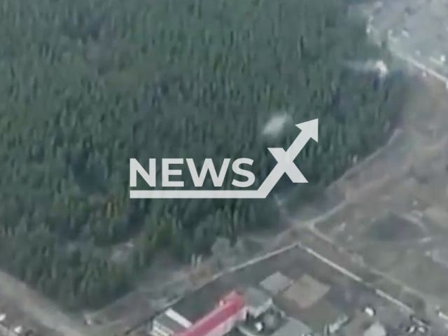 Ukrainan Army destroy a Russian tank in the forest in the Luhansk region, Ukraine, in April, 2022.  Note: This picture is a screenshot from the video (@NGUmainpage/Newsflash).