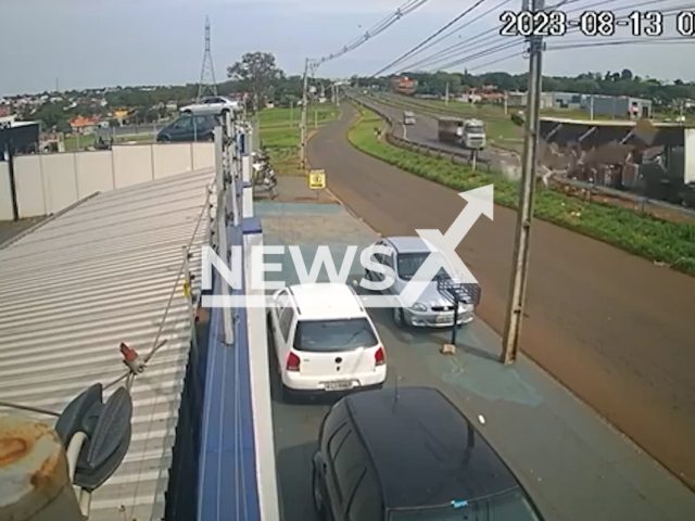 Tea bottles fall from a truck, spread on the highway, and knock down a motorcyclist, in Maringa, Brazil, undated. According to the Federal Highway Police (PRF), some products were looted by people passing by. Note: Picture is screenshot from a video. (Newsflash)