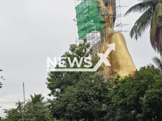 Picture shows a Buddha statue, under construction, in Phsar Leu Village Cambodia, undated. It was was widely criticized for having an ‘oddly proportioned face’. Note: Private photo (Newsflash)