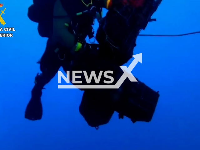 Picture shows the divers, in Las Palmas, Spain, undated. Police found 200 kilograms of cocaine in the submerged part of the hull of a ship. Note: Picture is screenshot from a video. (Newsflash)