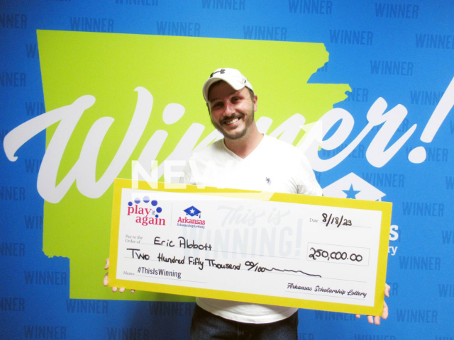 Eric Abbott poses with his prize check   in Little Rock, Arkansas, USA, undated. He won USD 250 thousand (GBP 196,201) after he was let go from his job of 20 years. Note: Licensed photo. (Arkansas Scholarship Lottery/Newsflash)