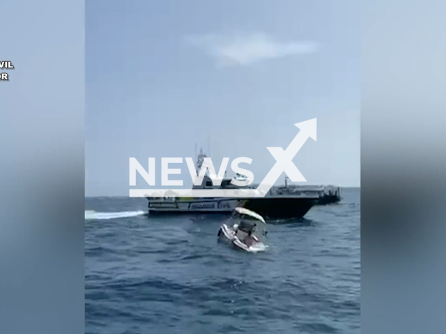 Police rescue a family of two minors and three adults from sinking boat, near L'Escala, Spain, on Thursday, Aug. 10, 2023. The souse of the sinking  was a large leak. Note: Picture is screenshot from a video. (CEN)