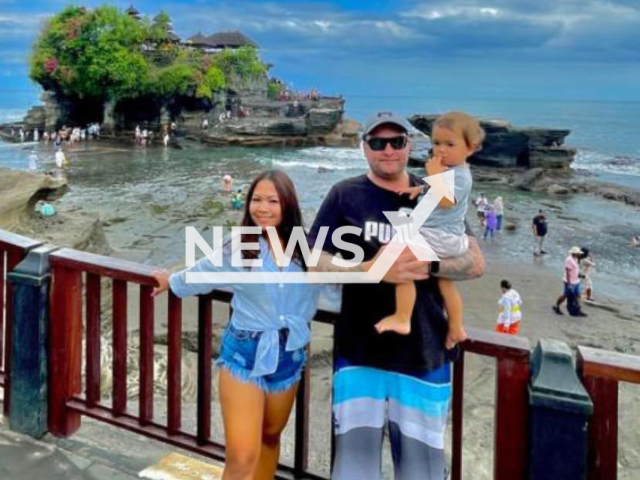 Photo shows Troy Johnson, 40, with his wife Ni Nyoman Purnianti, and their child, undated. He was killed by Gede Wijaya, 39, the owner of Uncle Benz Cafe in Denpasar, Bali, Indonesia. Note: Picture is private (Newsflash)