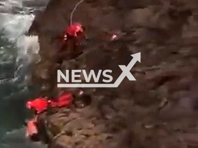 Two men in their fifties were saved by the rescue team with a helicopter on the coast of La Aldea de San Nicolas in Gran Canaria, Canary Islands on 13th April 2022. Note: This picture is a screenshot from the video (@112canarias/Newsflash).