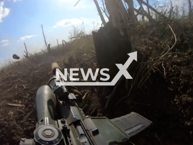 Ukrainian fighters fire with machine guns at Russian soldiers during close combat in Ukraine in undated footage. The footage was released by the 59th separate motorized infantry brigade on Monday, Aug. 28, 2023.
Note: Photo is screen from a video. (@59OMPBr/Newsflash)