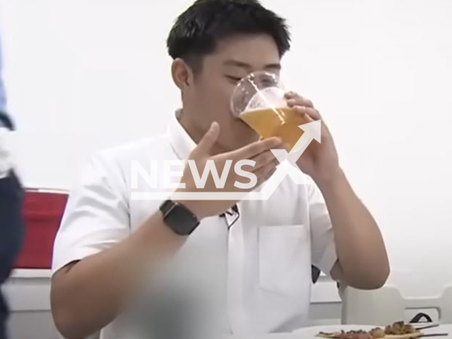 A driver drinks before a test in Chikushino, Japan,  on Monday, Aug. 21, 2023. A driving school held a driving test were all the candidates were drunk.  
 Note: Photo is a screenshot from video. (Newsflash)