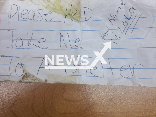 Picture shows the note that was attached to a dog's collar, undated. Police are looking for its owners in Platteville, WI. Note: Police photo. (Platteville WI Police/Newsflash)