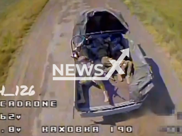 Russian soldiers fire with machine guns at the drone from a moving truck in Ukraine in undated footage. The footage was released by the 126th separate territorial defense brigade of Odessa on Wednesday, Aug. 30, 2023. Note: Photo is screen from a video. (@126brigadatro/Newsflash)