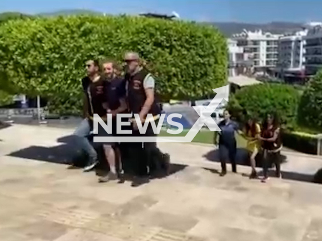 A British couple steals the bag of a person in a hotel in Marmaris, Mugla, Turkey, undated. The couple have been arrested. Note: Picture is screenshot from a video. (Newsflash)