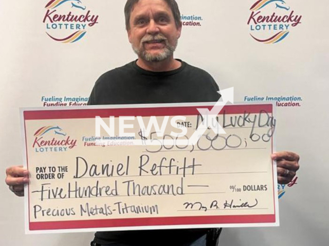 Daniel Reffitt  poses with his prize winning check, undated. He won USD 500 thousand on a Kentucky Lottery scratch-off ticket  and workers sitting nearby USD 100 each,  in Florence, Kentucky, USA. Note: Licensed content. (Kentucky Lottery/Newsflash)