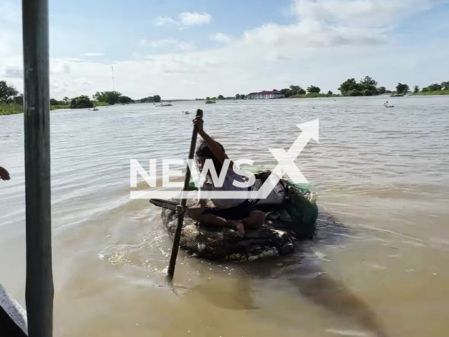 A  first-grade student, Kunthea,   paddling   on a raft made of garbage to attend schoolon the Tonle Sap lake, Cambodia, undated. The Acting Governor of Siem Reap, Mr. Prak Sophoan,  promised aid to make her trip easier. Note: Photo is a screenshot from video. (Newsflash)