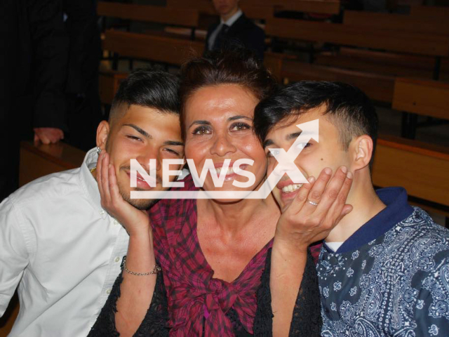 Rossella Nappini poses with unidentified men,  in undated photo. She was stabbed at least 20 times and killed by her ex Adil Harrati, in Rome, Italy. 

 Note: Private photo. (Newsflash)