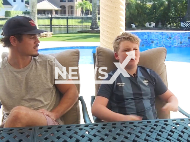 Photo shows Austen MacMillan (right) with Jason Piquette (left). The boy, 12, pulled the behavioral therapist from the bottom of his family’s pool in Wellington.
Note: Photo is a screenshot from a video(Newsflash).