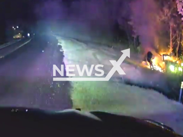 Police officer saves driver's life in a car crash in Madill, Oklahoma on the 9th of September 2023. Note: This picture is a screenshot from the video. (MadillPD/Clipzilla)