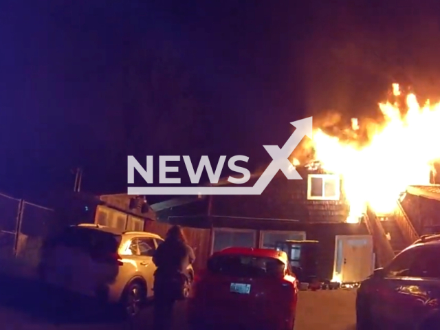 Police rescue residents from a raging house fire in Alagona, Washington on the 11th of September 2023.Note: This picture is a screenshot from the video. (AlgonaPD/Clipzilla)