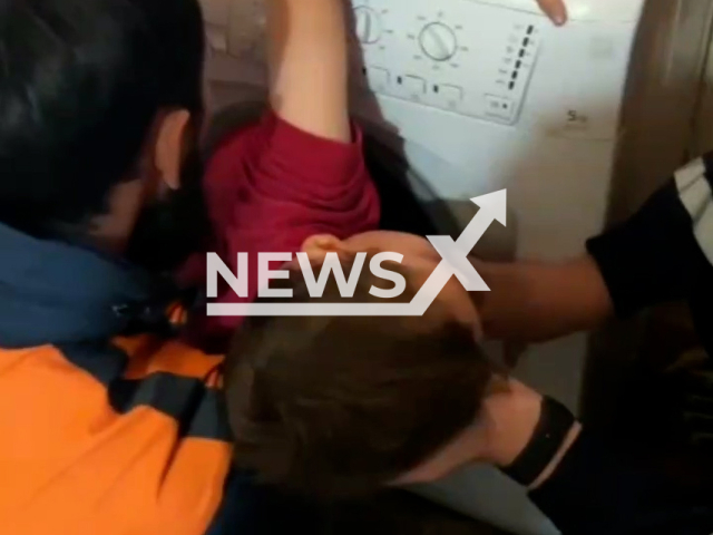 Rescuers take out a boy, 5, stuck inside a washing machine in Kazan, Russia on Monday, Sep. 11, 2023. The boy screamed and asked to stop pulling him out because he was afraid to break his leg. Note: Photo is a screenshot from a video (@mchstatarstan/Newsflash).