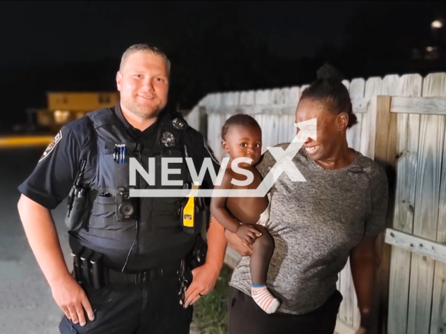 Officer Robert Baer with baby Zaire Brown and his mother Marchelle Brown. A heroic officer saves a baby's life in Murfreesboro, Tennessee on the 31st of August 2023. Note: This picture is a screenshot from the video. (Murfreesboro TN Police Department/Clipzilla)