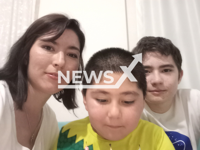 Photo shows Damira Zinnurova, with her children, undated. His ex-husband, Mustafa Topkaya, allegedly killed their son, Mehmet Topkaya, in Mersin, Turkey. Note: Picture is private (Damira Zinnurova/Newsflash)