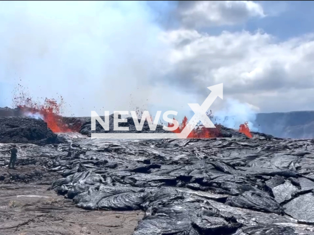 During an HVO eruption monitoring overflight on September 13, 2023, HVO geologists landed on the downdropped block within Kīlauea's summit caldera and searched for a safe place to collect a lava sample. Note: This picture is a screenshot from the video. (USGS/Clipzilla)