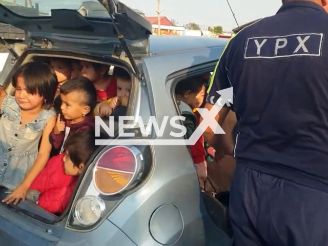 Footage shows car Chevrolet Spark full of little kids on the road in Bukhara, Uzbekistan, undated. Traffic police detained a woman who drove 25 kids inside the car. Note: Picture is screenshot from a video. (@YHXXUZ/Newsflash)