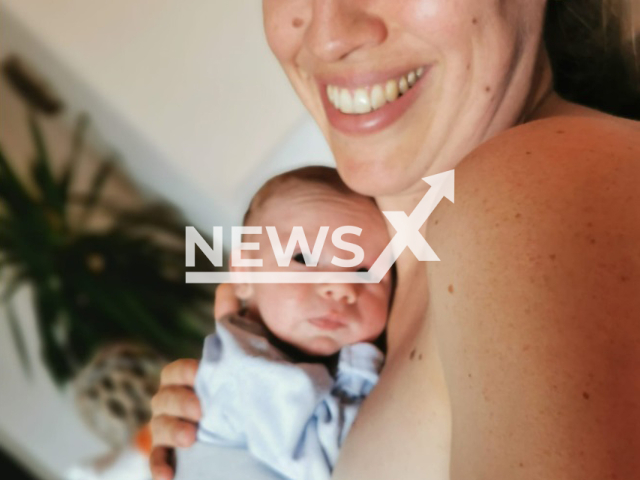 Janka Horvath, 39, poses with her baby in undated photo. She was kicked out of the ID office in the town of Interlaken, Switzerland, because she was breastfeeding the infant. Note: Private photo. (Newsflash)