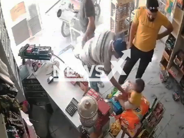 A man allegedly molests a toddler next to their father in a shop in Adana, Turkey, undated. The father of the toddler attacked the man, slapping and kicking him out of the shop. Note: Picture is screenshot from a video. (Newsflash)