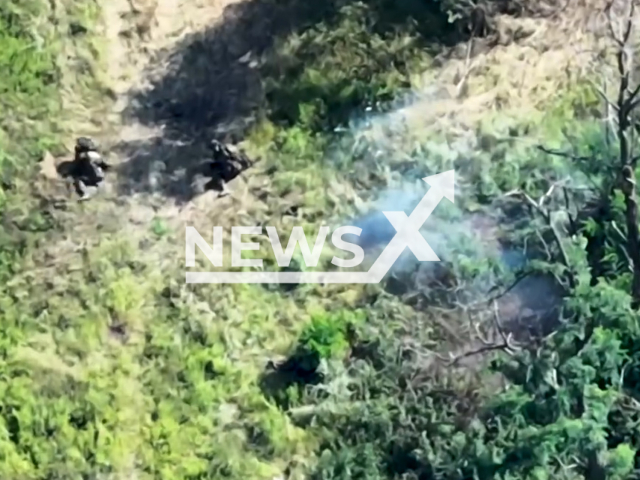 Ukrainian artillery and drone hits Russian soldiers making them flee among trees in Ukraine in undated footage. The footage was released by the 32nd Separate Mechanized Brigade of the Ukrainian Ground Forces on Wednesday, Sep. 27, 2023.Note: Picture is screenshot from a video. (@32OMB/Newsflash)