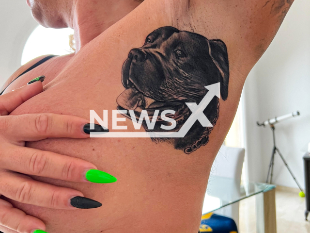 The tattoo on the armpit of Caroline Robens, 43,  of  a dog's head, on 6th April, in Majorca, Spain.
Note: Photo provided with permission. (Caroline Robens/Newsflash)