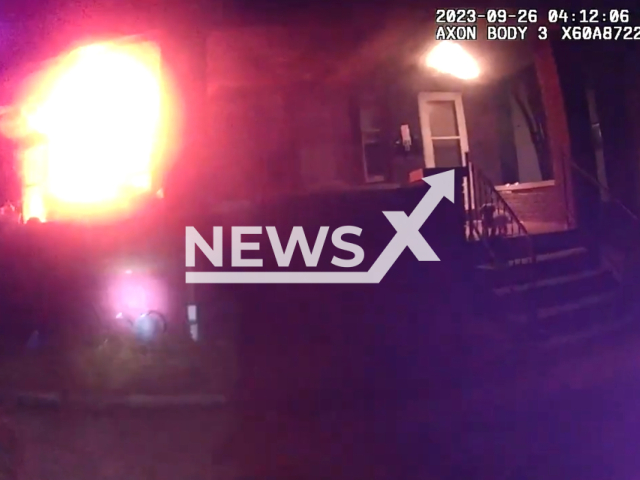 Police officers heroically rescue residents from a house fire in Columbus, Ohio on the 26th of September 2023. Note: This picture is a screenshot from the video. (Columbus Division of Police/Clipzilla)