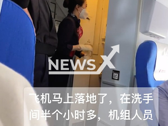 Plane crew opens toilet door as woman does not respond just to discover she was putting make up for 30 minutes on the China Eastern Airlines flight MU6303 from Beijing to Guangzhou. Note: This picture is a screenshot from the video (komyo4x/AsiaWire).