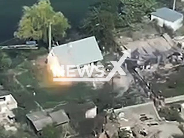 Ukrainian Border Guards drone hits house with Russian soldiers in Ukraine in undated footage. The footage was released by the State Border Guard Service of Ukraine on Wednesday, Sep. 27, 2023.  Note: Picture is screenshot from a video. (@DPSUkraine/Newsflash)