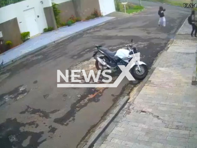 A young woman fought with a thief and prevented her motorcycle from being stolen on 13th April, in Passos, Brazil. Note: Picture is a screenshot from a video (Newsflash)