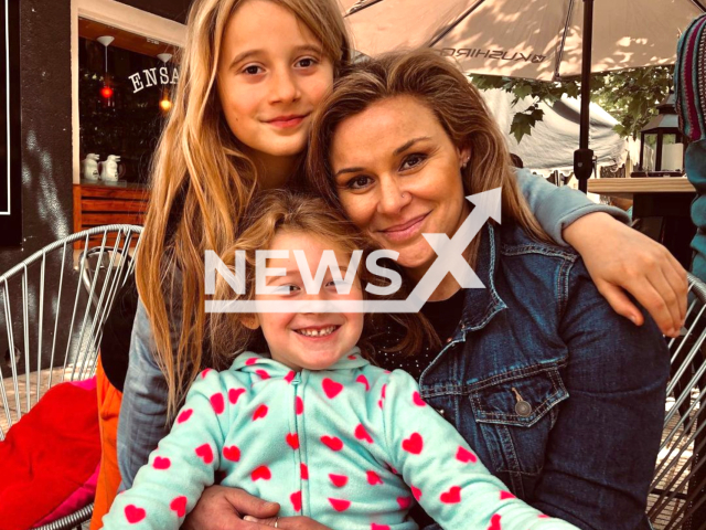 Jaqueline Carrieri poses with unidentified children,  in undated photo. She  died when she suffered complications that caused a clot after undergoing cosmetic surgery in Los Angeles, USA. Note: Private photo. (Newsflash)