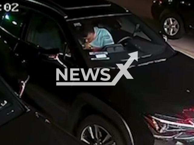 Photo shows Grubhub driver eating from a customer's order, undated. It happened in the parking lot in front of Mexihana's Hibachi Grill in Long Beach, California. 
Note: Photo is a screenshot from a video(Newsflash).