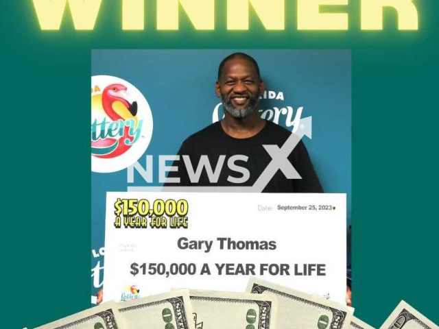 Gary Thomas, 49, poses with his prize winning check in an updated photo. He claimed a top prize from the USD 150,000 A YEAR FOR LIFE Scratch-Off and chose to receive his winnings as a one-time, lump-sum payment of USD 2,440,000 (GBP 2,003,667). Note: Licensed photo. (Florida Lottery/Newsflash)