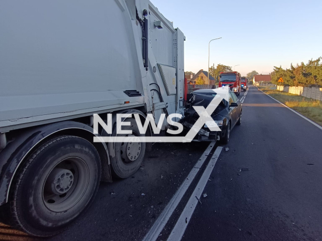 Photo shows the scene where a vehicle crashed a garbage truck, slamming a woman, in Milicz, Lower Silesian Voivodeship, in west-central Poland, Wednesday, Oct. 18, 2023. The woman was taken to hospital with injuries. Note: Photo is from the Cieszkow Fire Department (@OSPCieszkow/Newsflash)