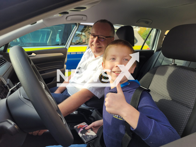 Photo shows Finn Elias in a patrol car and Tobias Hilbert, the head of the police station, next to him, undated. The boy, 11, rescued a pensioner, 74, from fire in Hoyerswerda, Saxony in Germany, in September 2023.
Note: Licensed photo(Goerlitz Police Department/Newsflash).