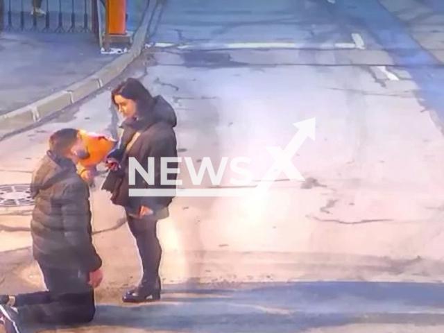 A man declares love to a woman on knees with flowers before being attacked by another man near residential house in Saint Petersburg, Russia on Sunday, Oct. 29, 2023. The romantic hold the bouquet using it as a weapon against the opponent.Note: Picture is screenshot from a video. (Newsflash)