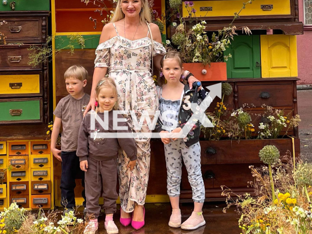 Photo shows Oksana Usova, with her children, after losing weight, undated. Usova, a mother of ten from Novosibirsk, Russia, became almost unrecognizable after losing more than 100 pounds. Note: Picture is private (Oksana Usova/Newsflash)