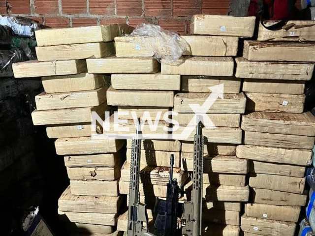 Picture shows the seized drugs and rifles, undated. The police have found seven tons of drugs, three rifles and 700 ammunition in a bunker located underground in a pigsty on a rural property in Palotina in western Parana, Brazil. Note: Police photo. (BPFron/Newsflash)