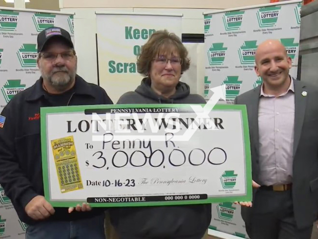 Penny Reep, 50, poses with husband (left) and unidentified man in undated footage. She bought the winning ticket at a store in Chicora, PA. Note: Image is a screenshot from video. (Newsflash)