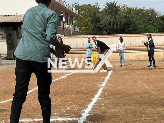 David Beckham plays cricket with children, in Gujarat, India, in November, 2023. He was playing cricket with the kids and visited them with UNICEF. Note: Private photo. (@davidbeckham/Newsflash)