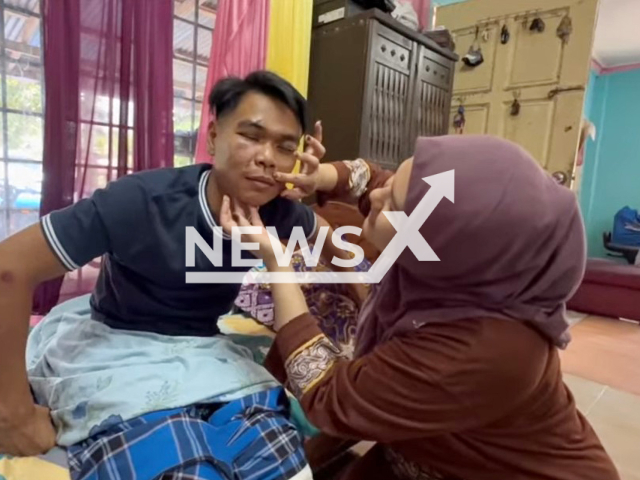 Picture shows Muhammad Zulhilmi Mokhtar, 26, with with his wife Nurul Izzati Syafiqah Suria Iskandar, 23, undated. He survived an ambush by tiger in Gua Musang, Malaysia. Note: Image is a screenshot from video. (Newsflash)